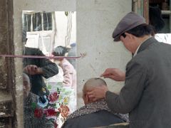 14 Kashgar Old City Street Scene 1993 Getting A Shaved Haircut